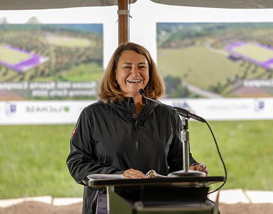 woman speaking at a podium