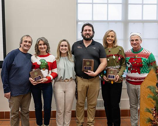 photo of six people standing in a row