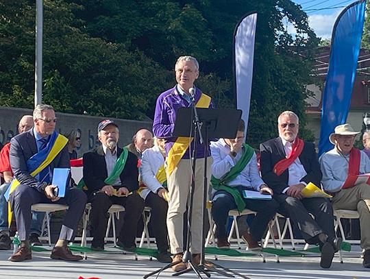 man speaking on a stage